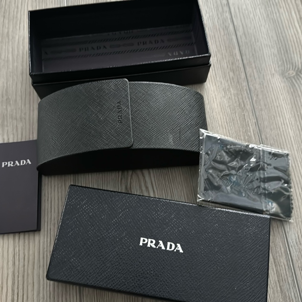 Authentic Prada sunglass case , and box and book and cloth
